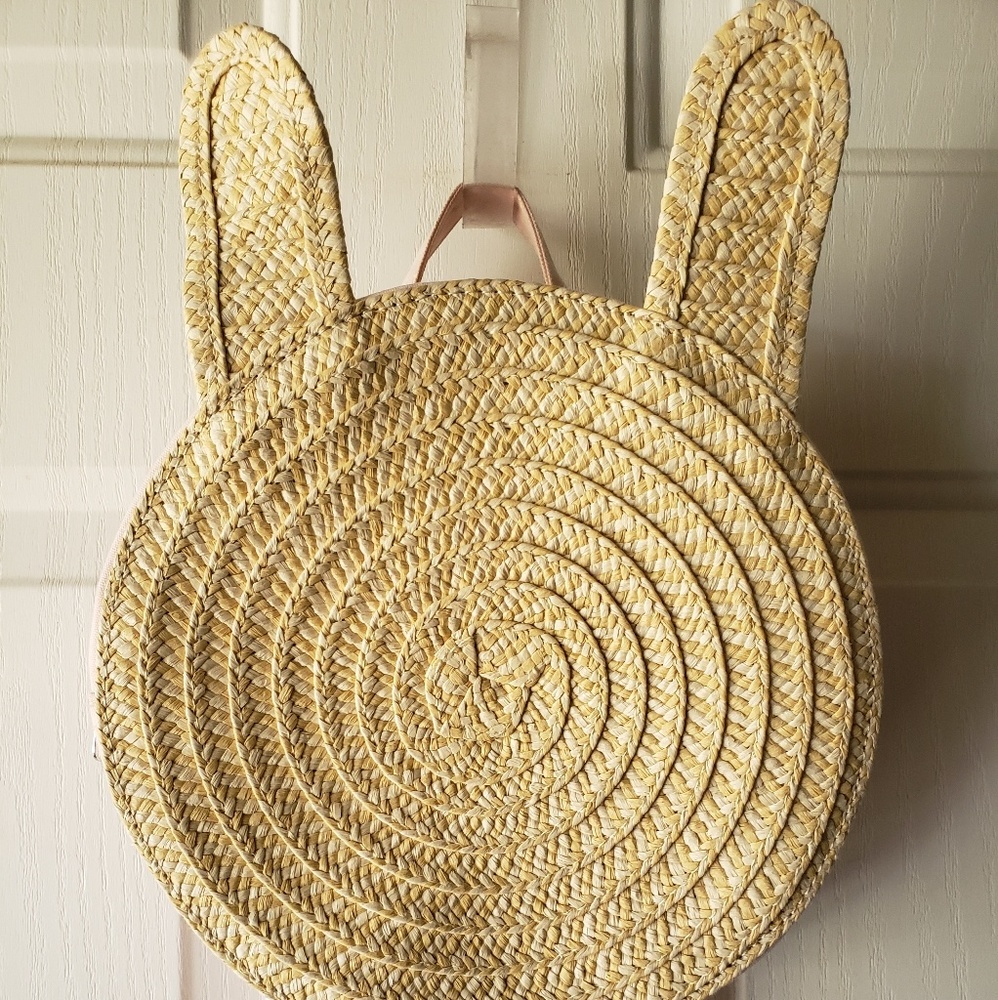 Straw woven bunny backpack.